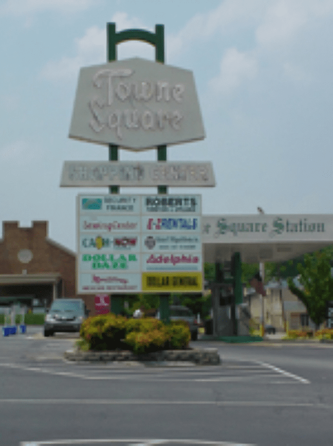 Towne Square shopping center sign with stores.